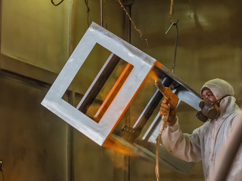 Spray coating method being used for an industrial application.